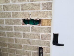 A brick missing from a wall | Featured image for the Major & Minor Building Defects blog article from ASBIR.